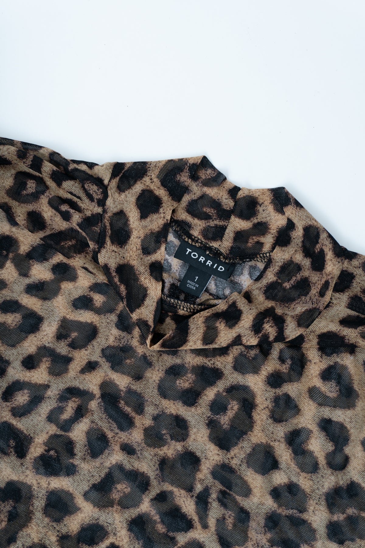 Sheer Animal Print Mock Neck Top